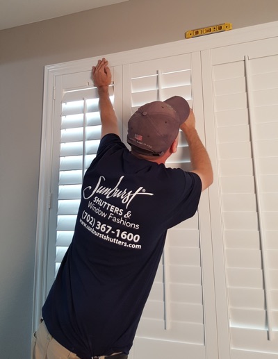 Shutter installation in Dallas bedroom.