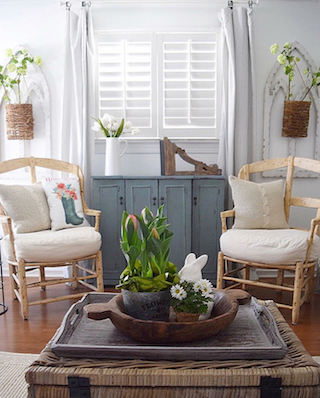 Plantation shutters in breezy sunroom.