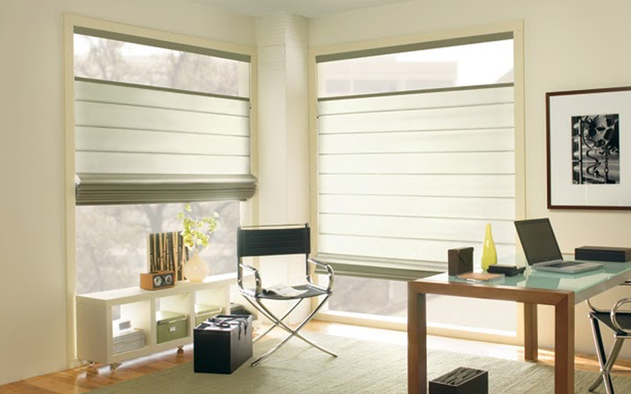 Upgrade your windows with stylish window shades or shutters in Dallas. Stylish sheer shades in the corner of a modern office.