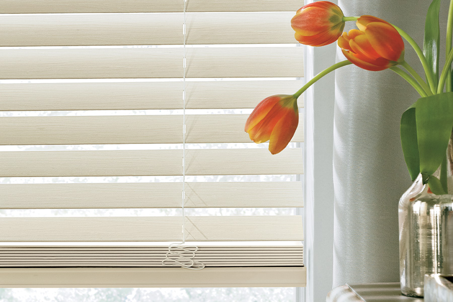 Up close shot of beige Polywood blinds.