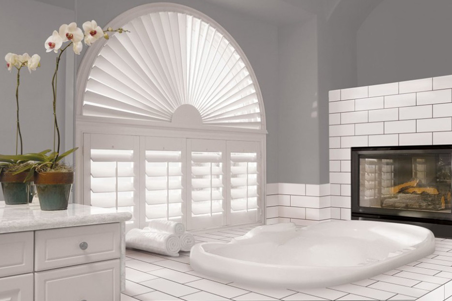 White Sunburst Polywood shutters in a large white bathroom