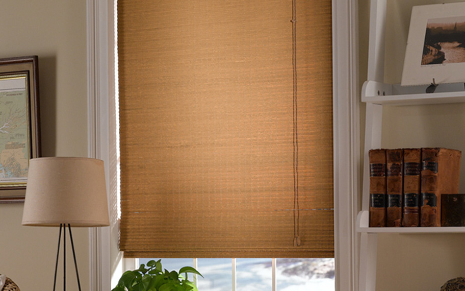 Add a touch of nature to your decor with woven fiber shades in Dallas. Tan woven fiber shades in a living room
