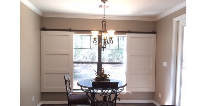 Barn doors open horizontally with slides instead of cords. Dallas barn door shutters