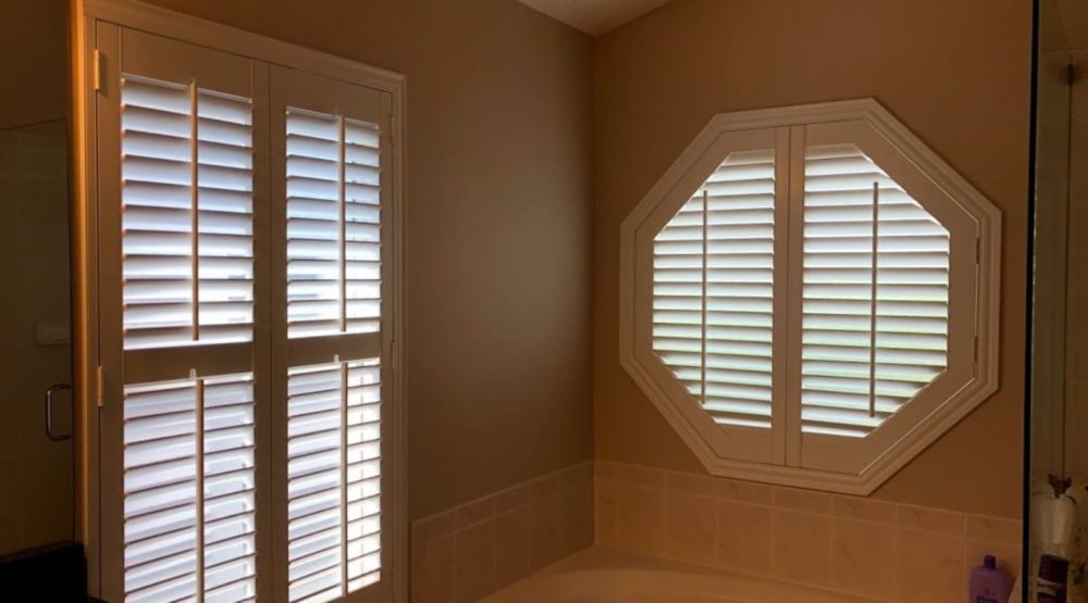 Octagon window treatments Octagon window in a Dallas bathroom